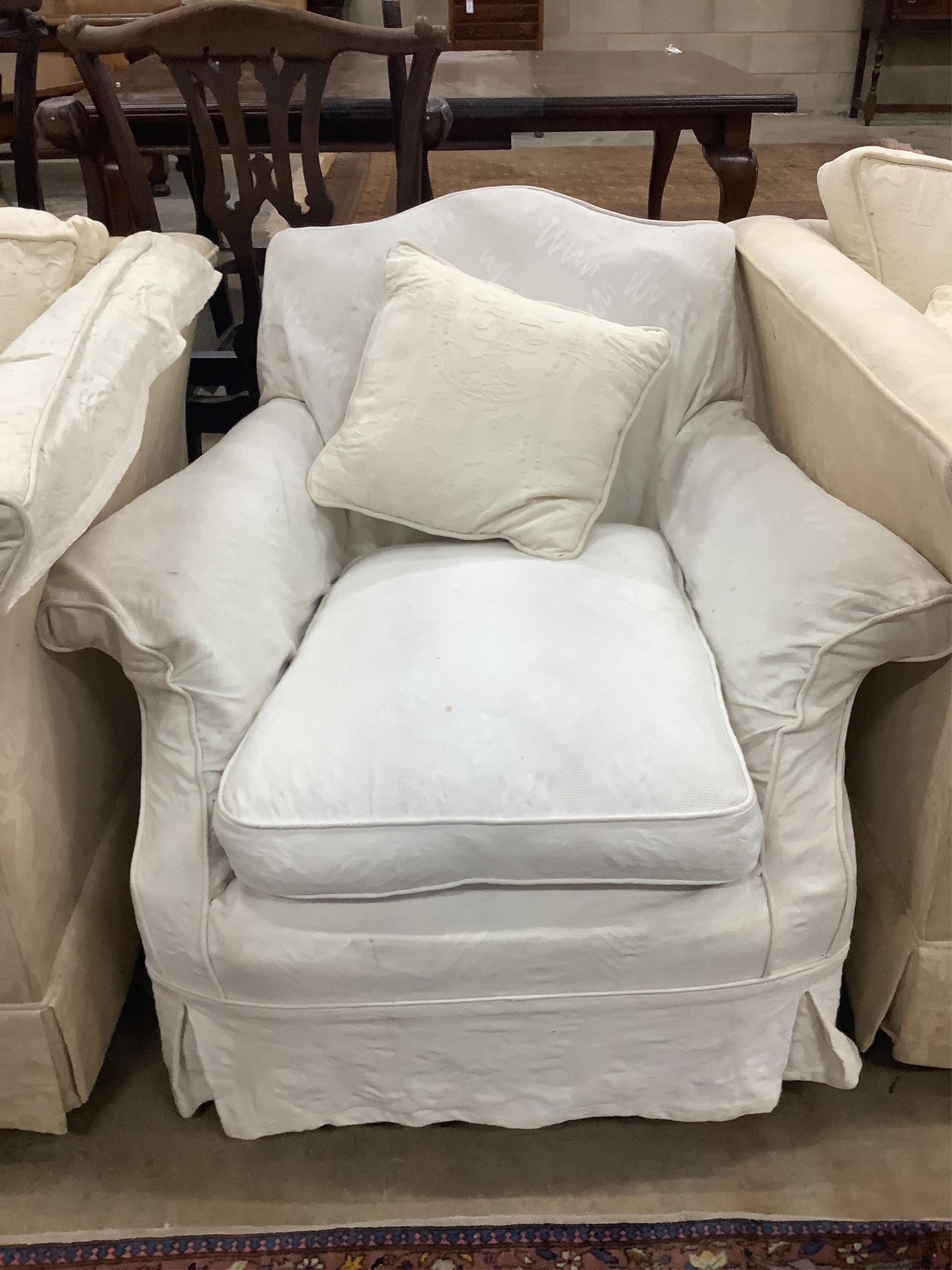 A pair of cream brocade upholstered three seater chesterfield settees, width 224cm, depth 91cm, height 72cm, and a matching lounge armchair. Condition - poor